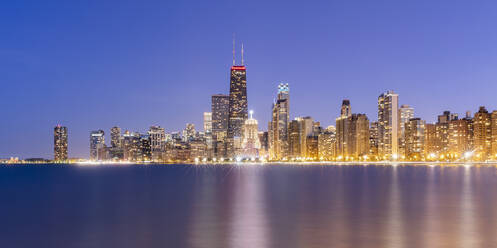 Illuminated view of urban skyline at dusk, Chicago, USA - AHF00170