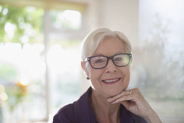 Portrait happy confident senior woman in eyeglasses - CAIF29869