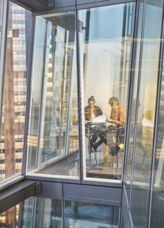 Business people meeting at modern highrise office window - CAIF29968