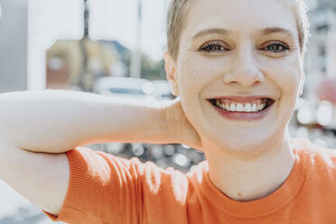 Close-up of woman smiling on sunny day - MFF06730