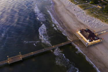 Germany, Mecklenburg-Western Pomerania, Heringsdorf, Aerial view of coastal pier at dawn - WDF06364