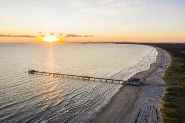 Germany, Mecklenburg-Western Pomerania, Heringsdorf, Aerial view of coastal pier at sunrise - WDF06365