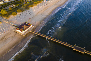 Germany, Mecklenburg-Western Pomerania, Heringsdorf, Aerial view of coastal pier at dawn - WDF06369