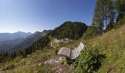 Empty bench on summit of Katrin mountain with cable car station in background - WWF05652