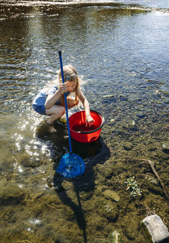 Little girl fishing in Edersee reservoir stock photo