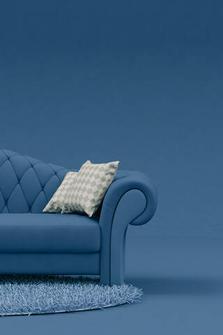 White cushions on blue sofa stock photo