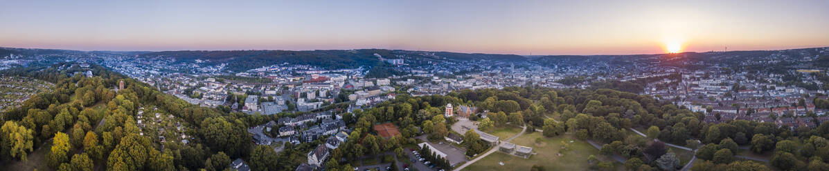 Germany, North Rhine-Westphalia, Wuppertal, Aerial panorama of Hardt park at sunset - SKAF00148