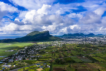 Mauritius, Black River, Flic-en-Flac, Helicopter view of island city with Corps de Garde mountain in background - AMF08665