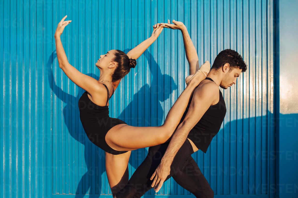 Modern Dance Photography.Young Mixed Ballet Dance Couple Performing  Together in Studio while Girl Posing in Bodysuit Against White Stock Image  - Image of entertainment, male: 263569091