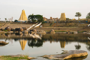 Lake by Virupaksha Temple against sky at Hampi, Karnataka, India - JMPF00563