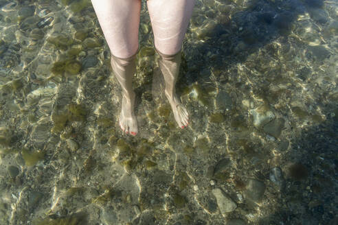 Womans legs in sea - CHPF00700