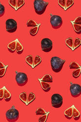 Directly above shot of fig fruit arranged on colored background - GEMF04392