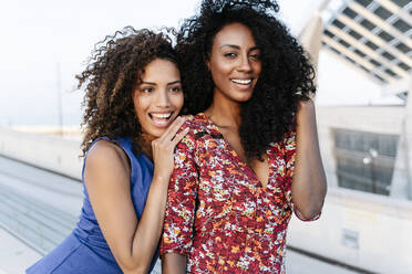 Cheerful female friends on rooftop - RDGF00246