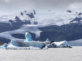 Icebergs floating in Jokulsarlon lake situated at head of Breidamerkurjokull glacier - LAF02504