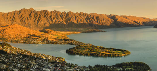 View over Queenstown and Lake Wakatipu to The Remarkables Mountains at sunset, Otago, South Island, New Zealand, Pacific - RHPLF17924