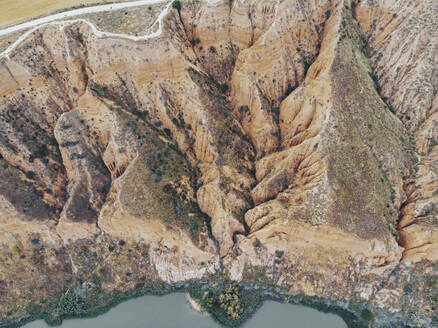 Aerial view of brown cliff in Barrancas de Burujon nature reserve - RSGF00438