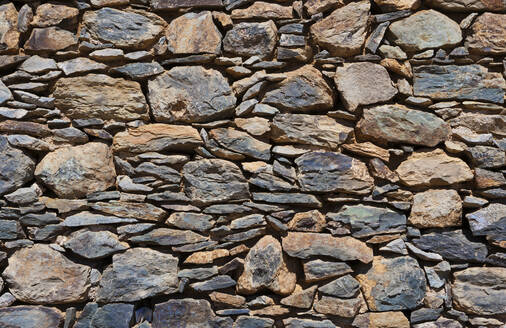 Full frame shot of stone wall on sunny day - WWF05713