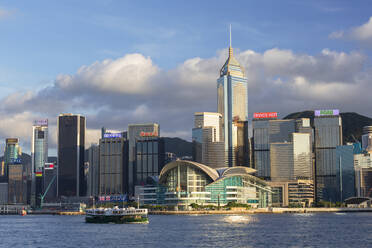 Star Ferry in Victoria Harbour with skyscrapers of Wan Chai, Hong Kong, China, Asia - RHPLF18240