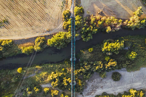 Bridge crossing river in landscape, aerial view stock photo