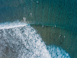 Surfers on sea waves, aerial view - KNTF05858