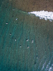 Surfers on sea waves, aerial view - KNTF05859