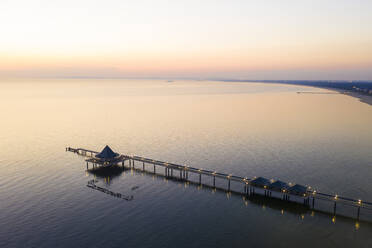 Germany, Usedom, Pier in sea at sunset, aerial view - WDF06390