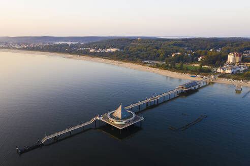 Germany, Usedom, Pier in sea at sunset, aerial view - WDF06395