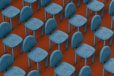 Rows of blue empty chairs on red background - GCAF00022