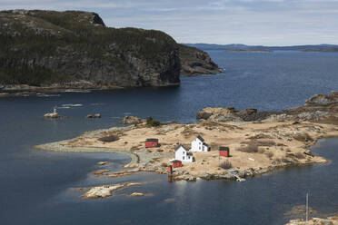 Houses on island with ocean in background - CAVF90797