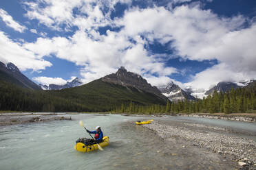 Man exploring the Alexandra River by inflatable packraft, hike, paddle - CAVF90929