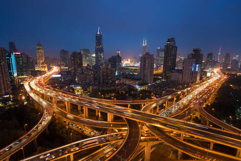 Elevated road junction and skyline of Shanghai, China at dusk. - MINF15402