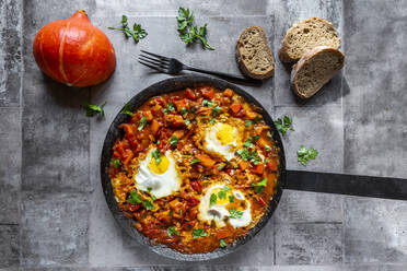 Frying pan with fresh ready-to-eat pumpkin shakshouka - SARF04641