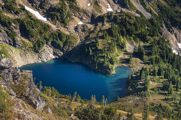 Blue alpine lake surrounded by green - CAVF91088