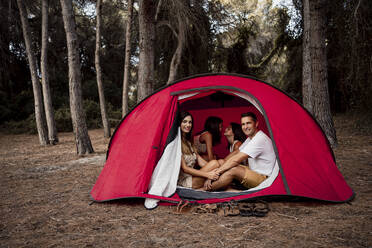 Happy family in tent during vacation - RCPF00317