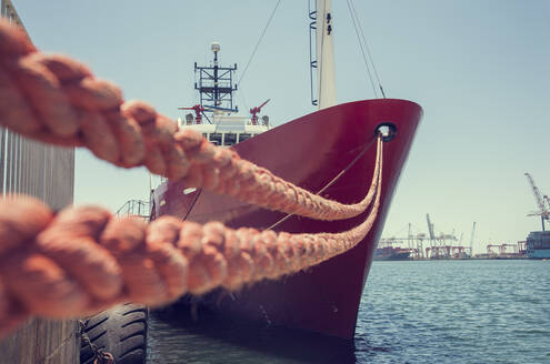 South Africa, Western Cape, Cape Town, Cargo ship moored in harbor - AJOF00680