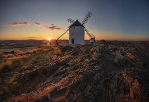 The castle and the windmills are Consuegra's stock photo