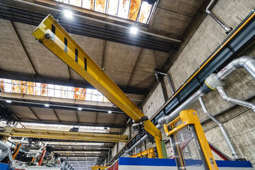 Industrial crane in illuminated factory - DIGF13532