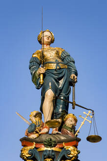 Switzerland, Canton of Bern, Bern, Statue of Lady Justice standing on top of Gerechtigkeitsbrunnen fountain - WDF06410