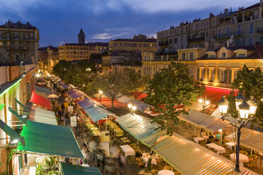 France, Provence-Alpes-Cote dAzur, Nice, Restaurant canopies stretching along Cours Saleya at dusk - WDF06414