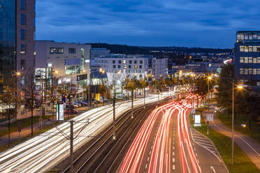 Germany, Baden-Wurttemberg, Stuttgart, Vehicle light trails along B 27 at dusk - WDF06417