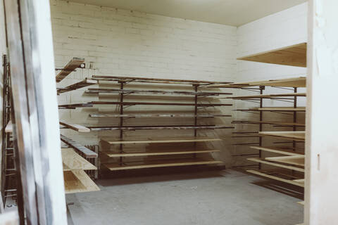 Planks in shelf at workshop stock photo