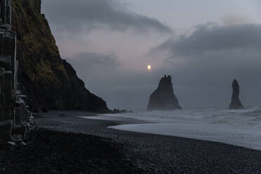 Moonlight above black sand beach of Reynisfjara, Iceland - CAVF91296