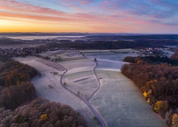 Drone view of countryside fields at foggy autumn dawn - STSF02700