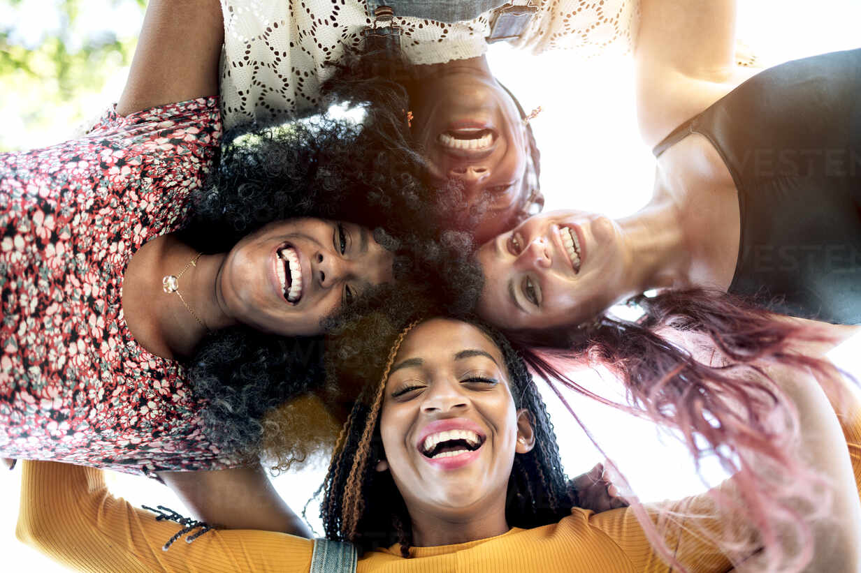 Group portrait of diverse young women wearing clothes in hipster