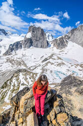 Climber on rocks at Bugaboo Property Released (PR)ovincial Park, British Columbia, Canada - ISF24306