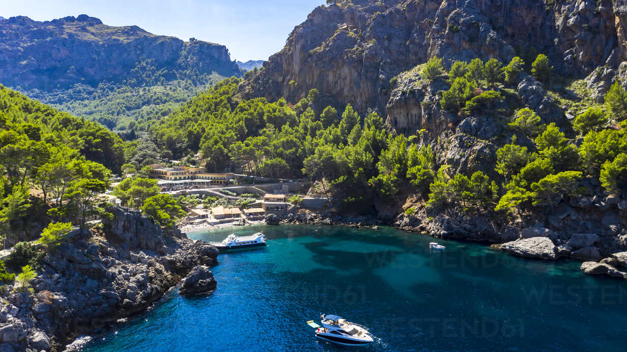Scenic view of sea with rock mountains on sunny day, Torrent De Pareis,  Sierra De Tramuntana,