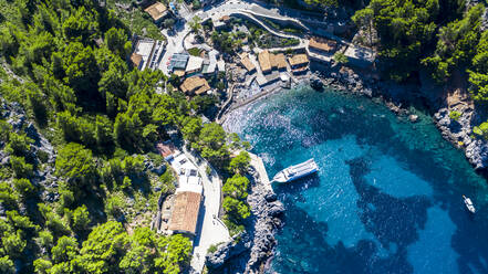 Drone shot of blue sea Sa Calobra, Majorca, Torrent De Pareis, Sierra De Tramuntana, Balearic Islands, Spain - AMF08829