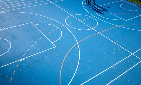 Blue Sports Court A detail of a colored sports court, lines and shadow stock photo