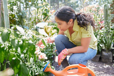 Latin woman doing garden work - CAVF91395