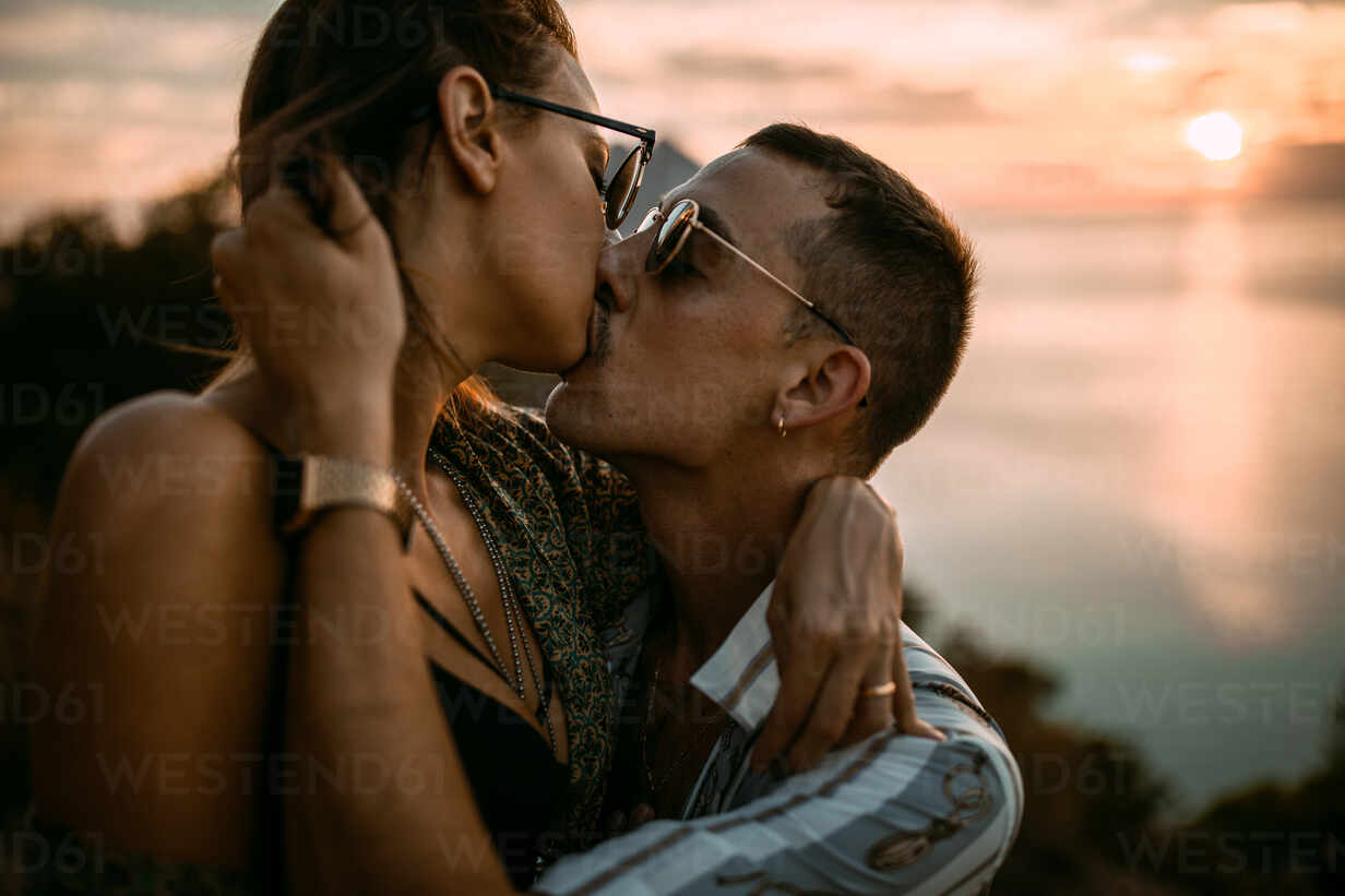 Premium Photo | A couple kissing in love by the sea